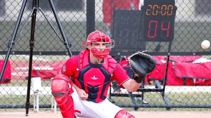 A new pitch clock counts down as Washington Nationals catcher Riley Adams catches a pitch during spring training workouts at the Ballpark of the Palm Beaches.